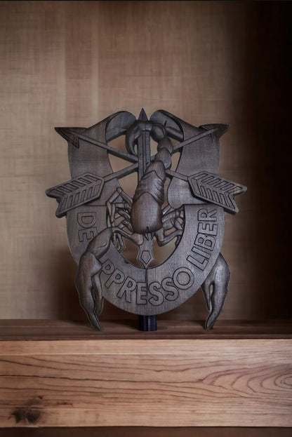 DE OPPRESSO LIBER carved out in wood