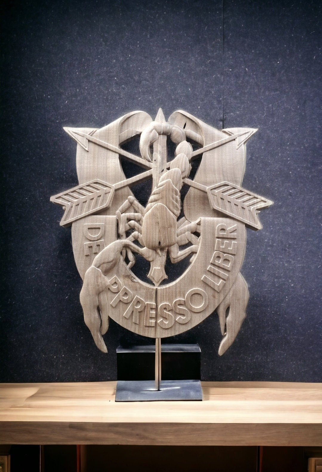 DE OPPRESSO LIBER carved out in wood